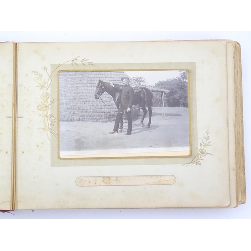 2050 - A late 19thC South African photograph album to include Swazi beehive huts, portraits of nurses, mili... 