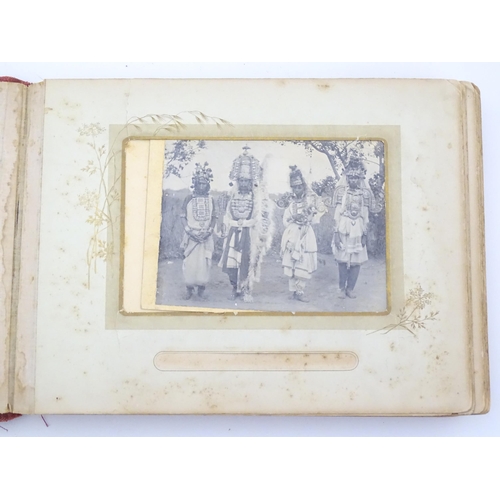 2050 - A late 19thC South African photograph album to include Swazi beehive huts, portraits of nurses, mili... 