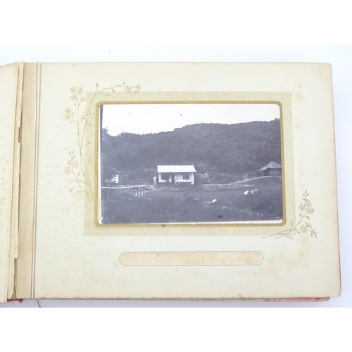 2050 - A late 19thC South African photograph album to include Swazi beehive huts, portraits of nurses, mili... 