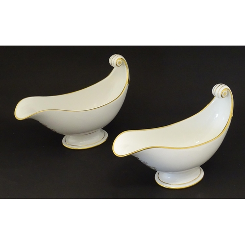 66 - A pair of large French Dore a Sevres sauce boats with scroll handles, decorated with gilt crowned Na... 