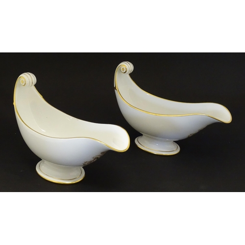 66 - A pair of large French Dore a Sevres sauce boats with scroll handles, decorated with gilt crowned Na... 