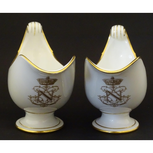 66 - A pair of large French Dore a Sevres sauce boats with scroll handles, decorated with gilt crowned Na... 