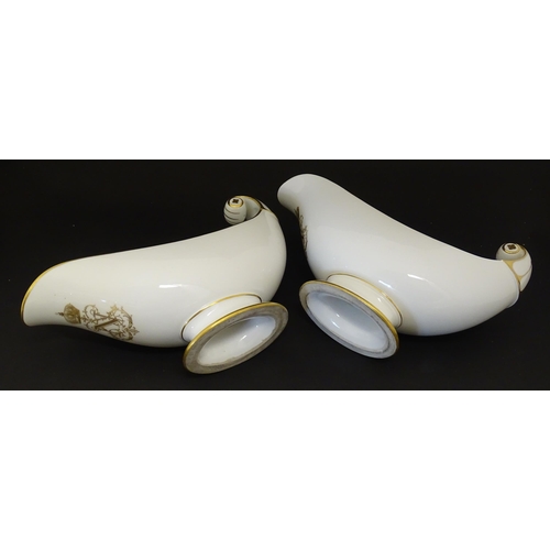 66 - A pair of large French Dore a Sevres sauce boats with scroll handles, decorated with gilt crowned Na... 