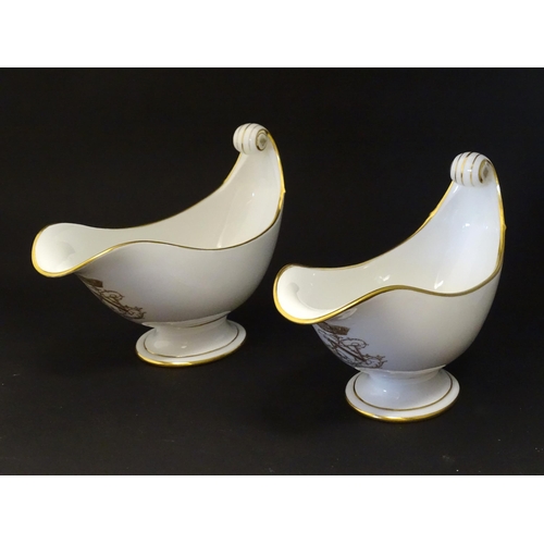 66 - A pair of large French Dore a Sevres sauce boats with scroll handles, decorated with gilt crowned Na... 