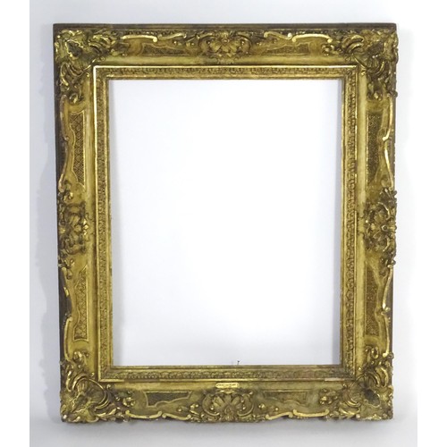 2011 - A large 19thC gilt wood and gesso swept frame. Aperture approx. 36 1/4