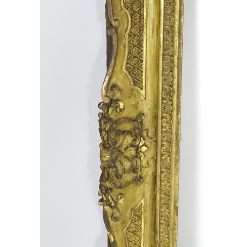 2011 - A large 19thC gilt wood and gesso swept frame. Aperture approx. 36 1/4