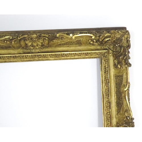 2011 - A large 19thC gilt wood and gesso swept frame. Aperture approx. 36 1/4