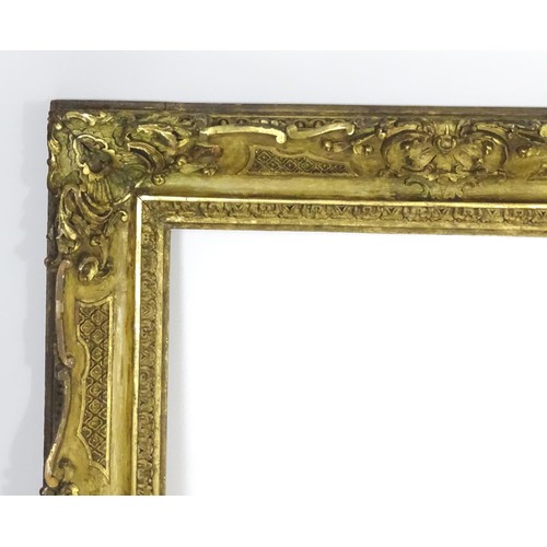 2011 - A large 19thC gilt wood and gesso swept frame. Aperture approx. 36 1/4