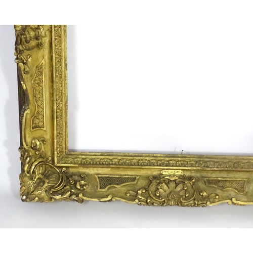 2011 - A large 19thC gilt wood and gesso swept frame. Aperture approx. 36 1/4