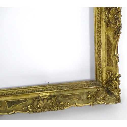 2011 - A large 19thC gilt wood and gesso swept frame. Aperture approx. 36 1/4