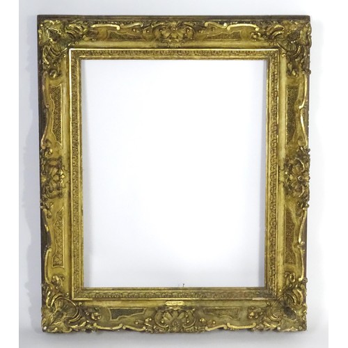 2011 - A large 19thC gilt wood and gesso swept frame. Aperture approx. 36 1/4