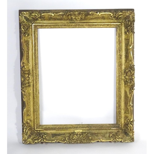 2011 - A large 19thC gilt wood and gesso swept frame. Aperture approx. 36 1/4