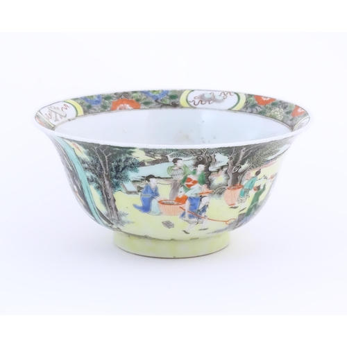 2 - A Chinese famille jaune bowl decorated with figures in a landscape. Double blue circle mark under. A... 