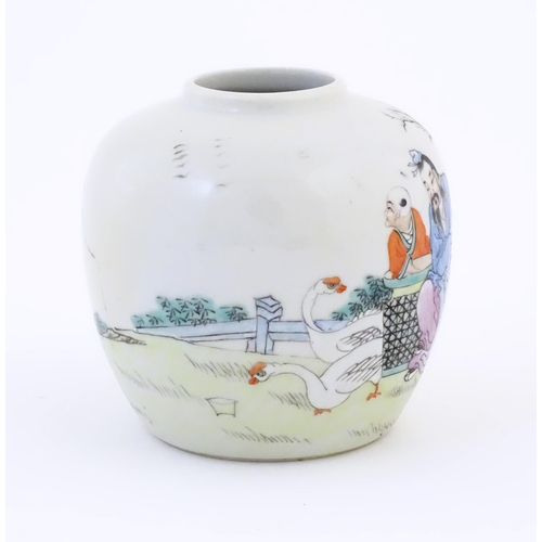 3 - A Chinese jar / vase decorated with figures in a landscape. Character marks under. Approx. 4 3/4