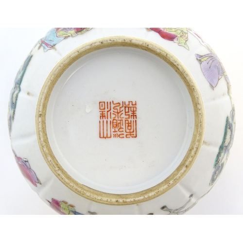 19 - A Chinese famille rose bowl decorated with figures in a stylised landscape. Approx. 3