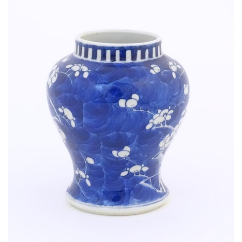 29 - A Chinese blue and white vase decorated with blossom. Character marks under. Approx. 6 1/4