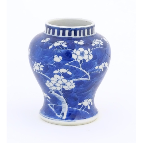 29 - A Chinese blue and white vase decorated with blossom. Character marks under. Approx. 6 1/4