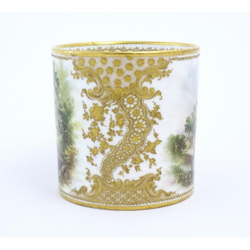 64 - A 19thC English Derby style mug with floral and foliate gilt detail and hand painted landscape scene... 