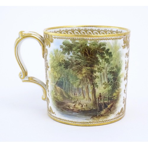 64 - A 19thC English Derby style mug with floral and foliate gilt detail and hand painted landscape scene... 