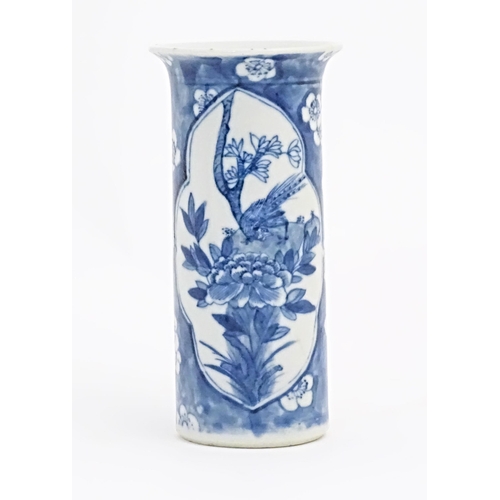 27 - A Chinese blue and white vase of cylindrical form with a flared rim, decorated with birds, flowers a... 