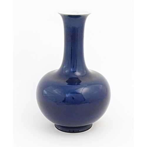 9 - A Chinese Shangping style vase with blue ground and flared rim. Character marks under. Approx. 14 1/... 
