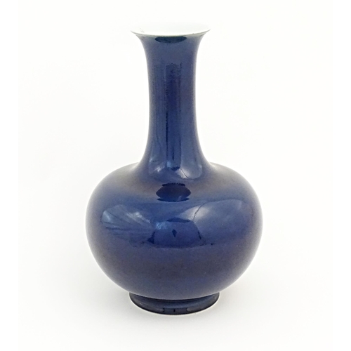 9 - A Chinese Shangping style vase with blue ground and flared rim. Character marks under. Approx. 14 1/... 