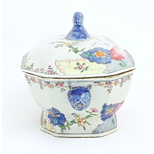 37 - A Chinese export famille rose lidded tureen decorated in the tobacco leaf pattern with flowers and f... 