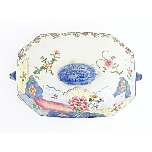 37 - A Chinese export famille rose lidded tureen decorated in the tobacco leaf pattern with flowers and f... 