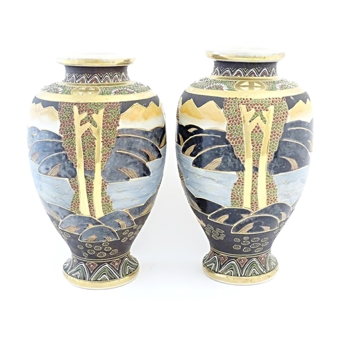 47 - A pair of Japanese Satsuma vases of baluster form decorated with a central female figure bordered by... 