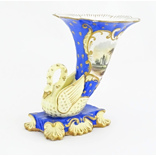 75 - A Victorian vase with swan detail to base, the body decorated with ruins in a landscape and gilt hig... 