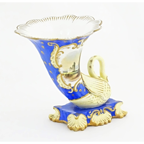 75 - A Victorian vase with swan detail to base, the body decorated with ruins in a landscape and gilt hig... 