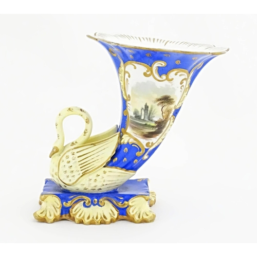 75 - A Victorian vase with swan detail to base, the body decorated with ruins in a landscape and gilt hig... 