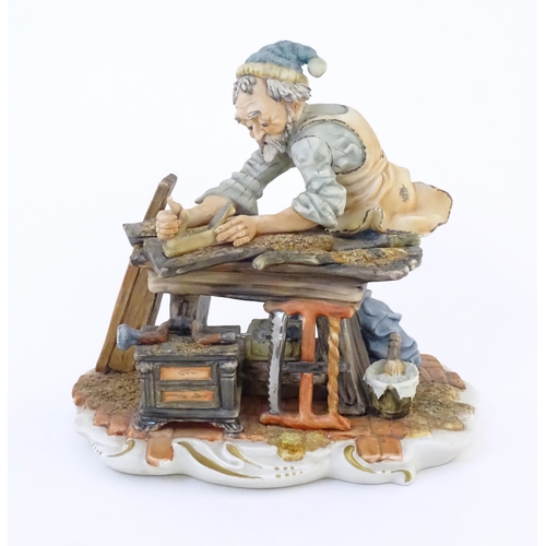 140 - An Italian Capodimonte model of a Carpenter, and signed Milio. Marked under with pattern no. 162. Ap... 