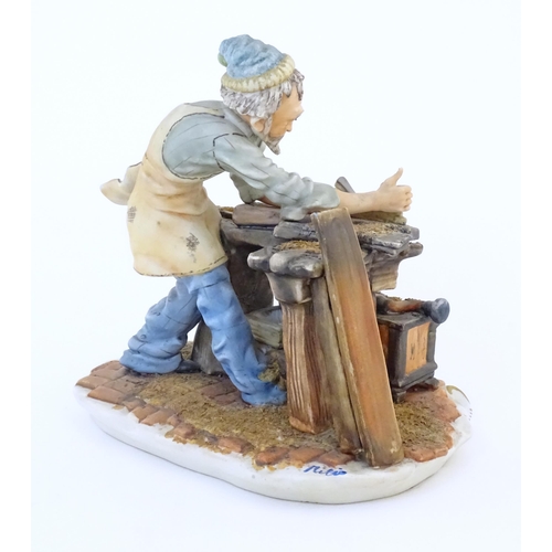 140 - An Italian Capodimonte model of a Carpenter, and signed Milio. Marked under with pattern no. 162. Ap... 