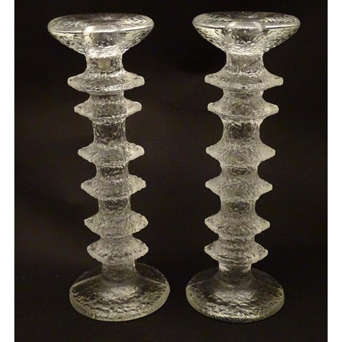 157 - Finnish Art Glass: A pair of Iittala glass candlesticks. 9 3/4