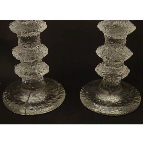 157 - Finnish Art Glass: A pair of Iittala glass candlesticks. 9 3/4