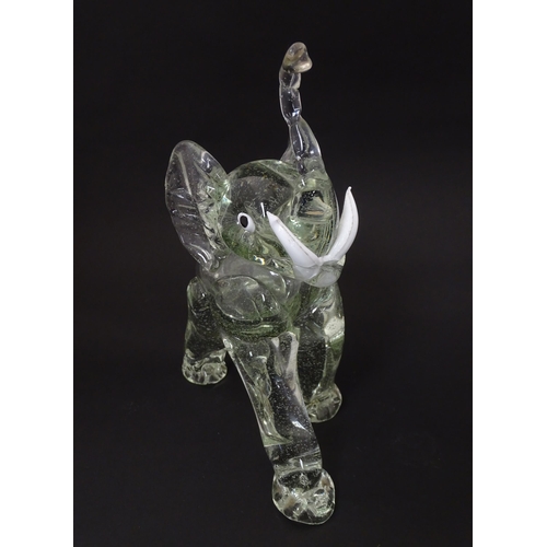 172 - A vintage glass model of an elephant in the manner of Ercole Barovier. Approx 10 1/2