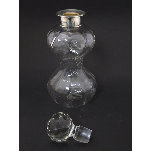 183 - A glass decanter with silver collar hallmarked Birmingham 1911 maker Mappin & Webb and numbered 1725... 