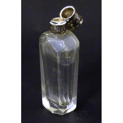 188 - A glass scent / perfume  bottle with Dutch silver top. Approx  3 1/2