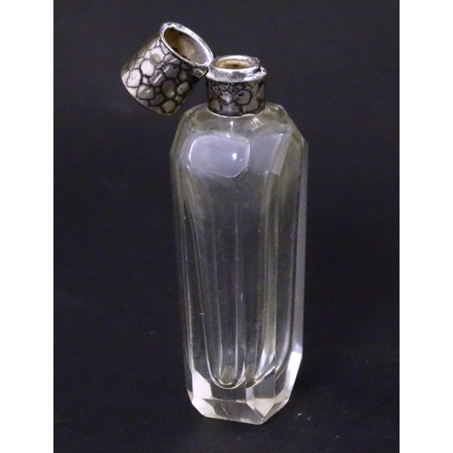 188 - A glass scent / perfume  bottle with Dutch silver top. Approx  3 1/2