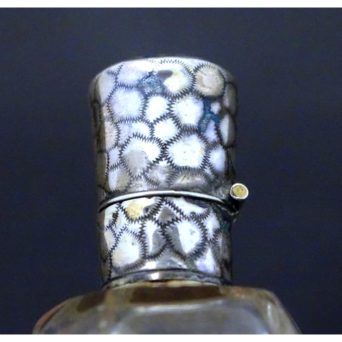 188 - A glass scent / perfume  bottle with Dutch silver top. Approx  3 1/2