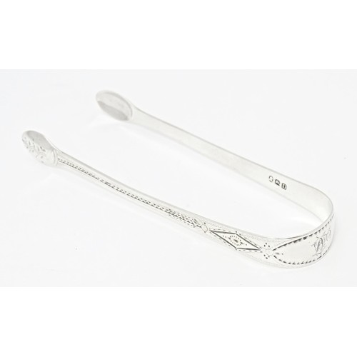 221 - Geo III silver sugar tongs with bright cut  decoration, hallmarked London 1799, maker Thomas Wallis.... 