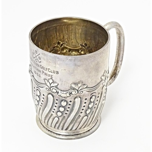 226 - A Victorian silver mug with embossed decoration with later inscription 'Selsdon Park Golf Club, Coro... 