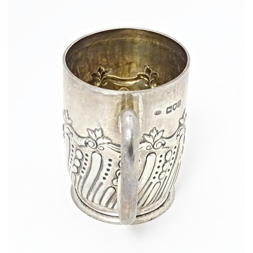 226 - A Victorian silver mug with embossed decoration with later inscription 'Selsdon Park Golf Club, Coro... 