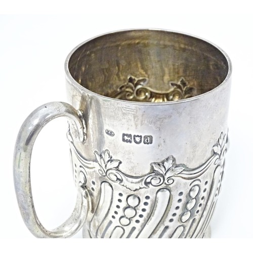 226 - A Victorian silver mug with embossed decoration with later inscription 'Selsdon Park Golf Club, Coro... 