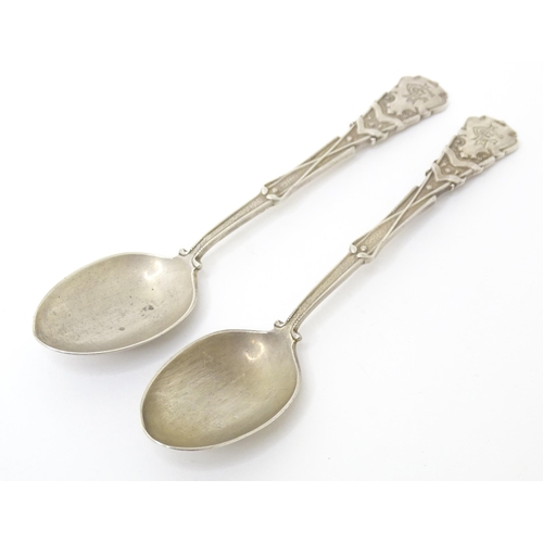 451 - A pair of silver spoons decorated with golf clubs, golf balls, etc. hallmarked Sheffield 1931,
maker... 