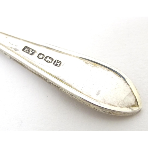 452 - A silver preserve spoon hallmarked Sheffield 1959, maker Viner' Ltd. Together with silver sugar tong... 