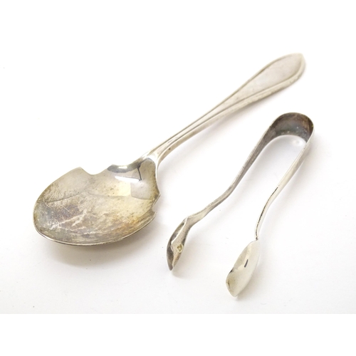 452 - A silver preserve spoon hallmarked Sheffield 1959, maker Viner' Ltd. Together with silver sugar tong... 