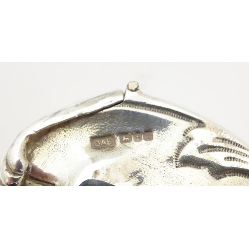 454 - A silver novelty vesta case formed as a crescent moon with face, hallmarked London 1997, maker David... 