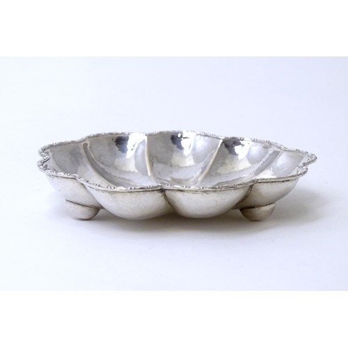 460 - A Continental .800 silver dish of lobed form with hammered decoration. Approx. 3 1/2